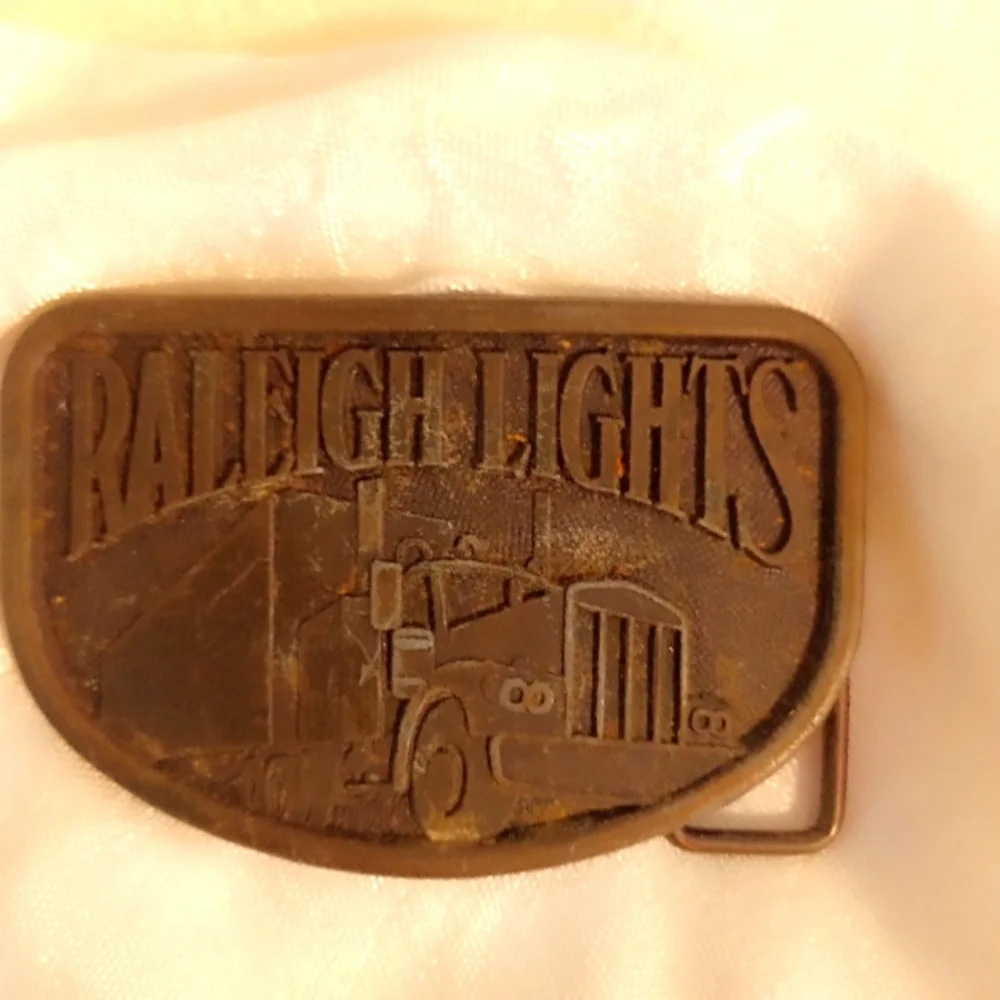 Raleigh Lights Trucking belt buckle 1970s Vintage